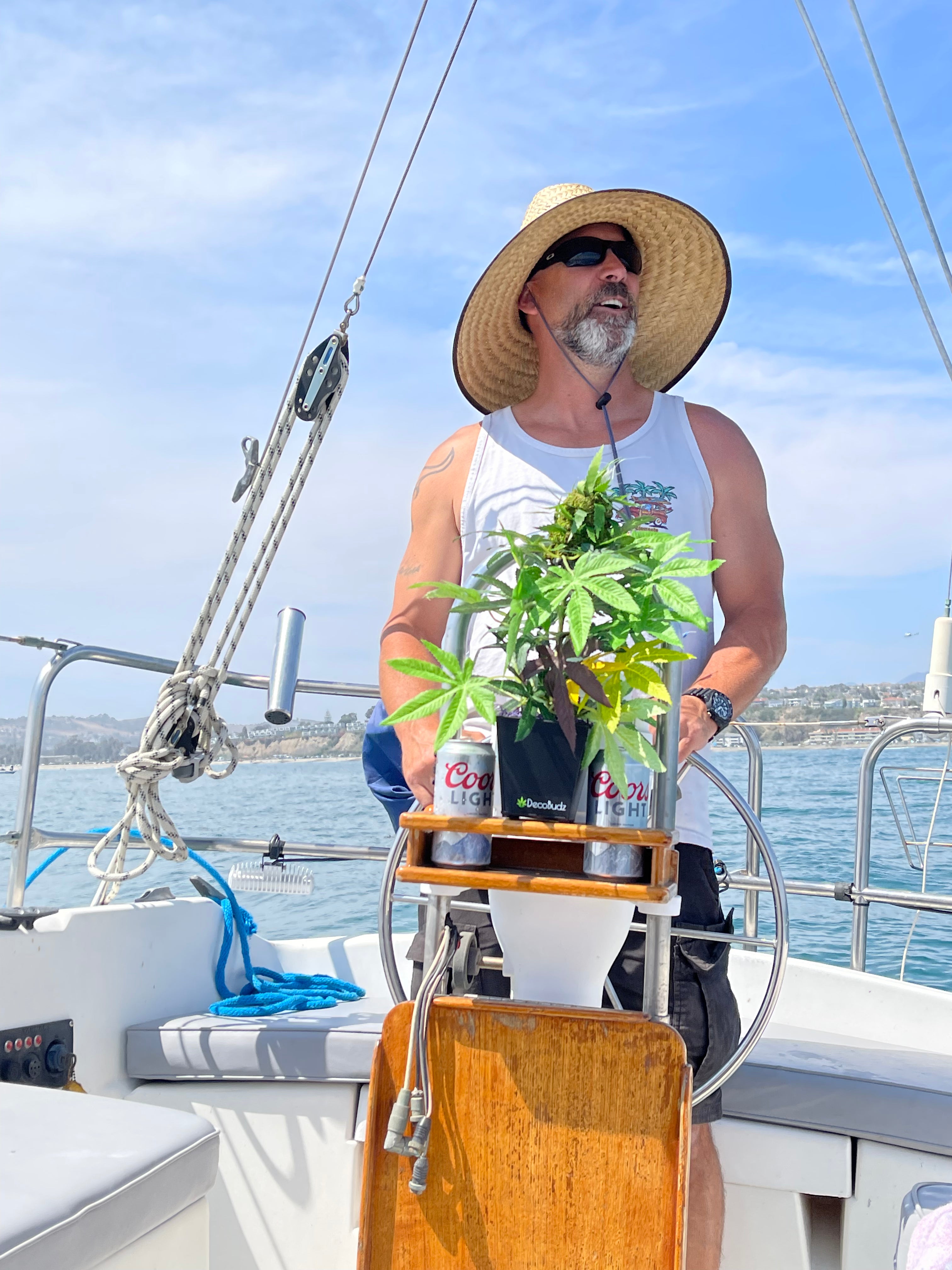 Decobuds replica weed plant on a sailboat with a salty captain 